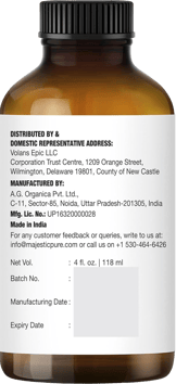 Brown bottle showing Majestic Pure lavender oil label with distributor, manufacturer, volume info