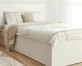 clean bedroom and made bed