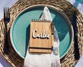 a notepad with a personalized wood name