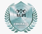 a badge with a shield and laurels on it