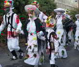 a group of people dressed in costumes and hats