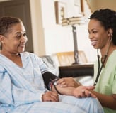 a nurse and a nurse in a hospital room