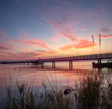 Altnau, Bodensee - Sonnenuntergang mit Steg und Spiegelung im Wasser