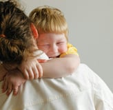 mother holding son