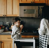 son helping mom in kitchen