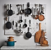 a kitchen with pots and pans of cooking utensils