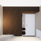 Chambre principale de l'appartement de Knokke mobilier sur mesure en effet noyer