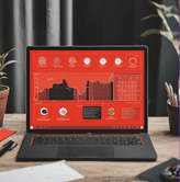 a laptop computer ACE.up!  AI ERP with a red screen and a laptop on a desk