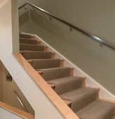 modern staircase with metal railing