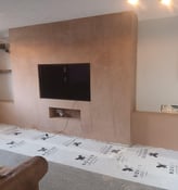 Plastering a living room wall in Worcester, smooth finish by local experts D and N Plastering.