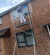 Mr Spray technician wearing protective gear for UPVC spraying in Worcester