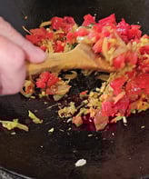 Wood spoon and tomates and oignons