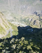 a mountain view of a valley with a winding road