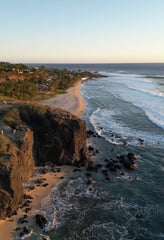 a beach with a view of the ocean and a beach