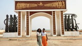 Tourists visiting Slave Door of No Return in Benin