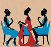 a woman sitting in a chair with two women