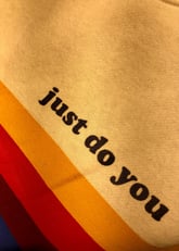 a colorfully coloured sweatshirt with the words just do you