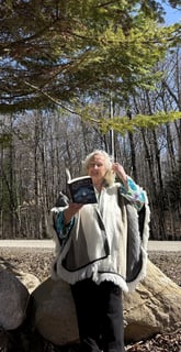 Tammie Whalen Buckler holding book, "Echoes Between Realms"