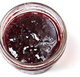 A little container of red raspberry jam