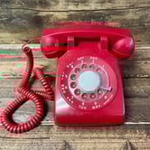 an old fashioned red telephone