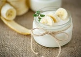 a jar of yogurt with bananas and yogurt