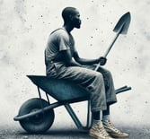 a man sitting in a wheelbarrow