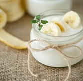 a jar of yogurt with bananas and yogurt