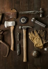 a variety of tools and tools on a wooden table