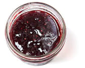 A little container of red raspberry jam