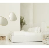 a bedroom with a bed set in the centre 