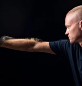 a man holding a snake
