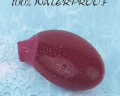 a red object in the water with water droplets on the surface