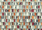 Symmetrical facade of colourful apartment balconies in an urban art photograph by Martin Osner