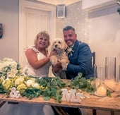 Couple With Their Dog At The end Of Their Ceremony