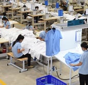 Finished clothing line prepared for shipping from Canadian facility