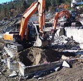 two excavators digging