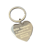 a heart shaped keychain with memorial