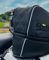 Remy rain cover folded compactly for storage, demonstrating portability and ease of use