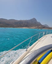 approaching a remote beach by boat