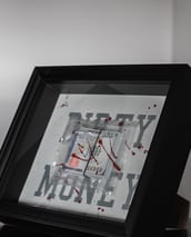a frame with dollars and motivational quotes