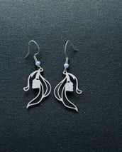 a pair of earrings with a flower on it