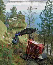 Spider excavator cleaning up debris on firesmart project near Kelowna BC