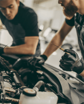 Expert mechanics performing an oil change, ensuring top performance and longevity for your vehicle