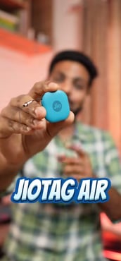 person holding jio tag device 