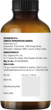 Brown bottle showing Majestic Pure lavender oil label with distributor, manufacturer, volume info