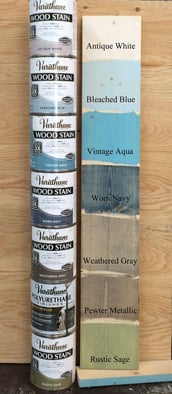 a stack of paint and woodworking supplies for sale