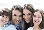 Smiling family of four