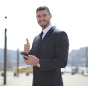 Businessman-smiling-and-thumbs up