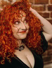 woman with ginger/copper curly hair