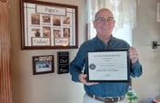Daniel Bean holding Life Coach Certificate